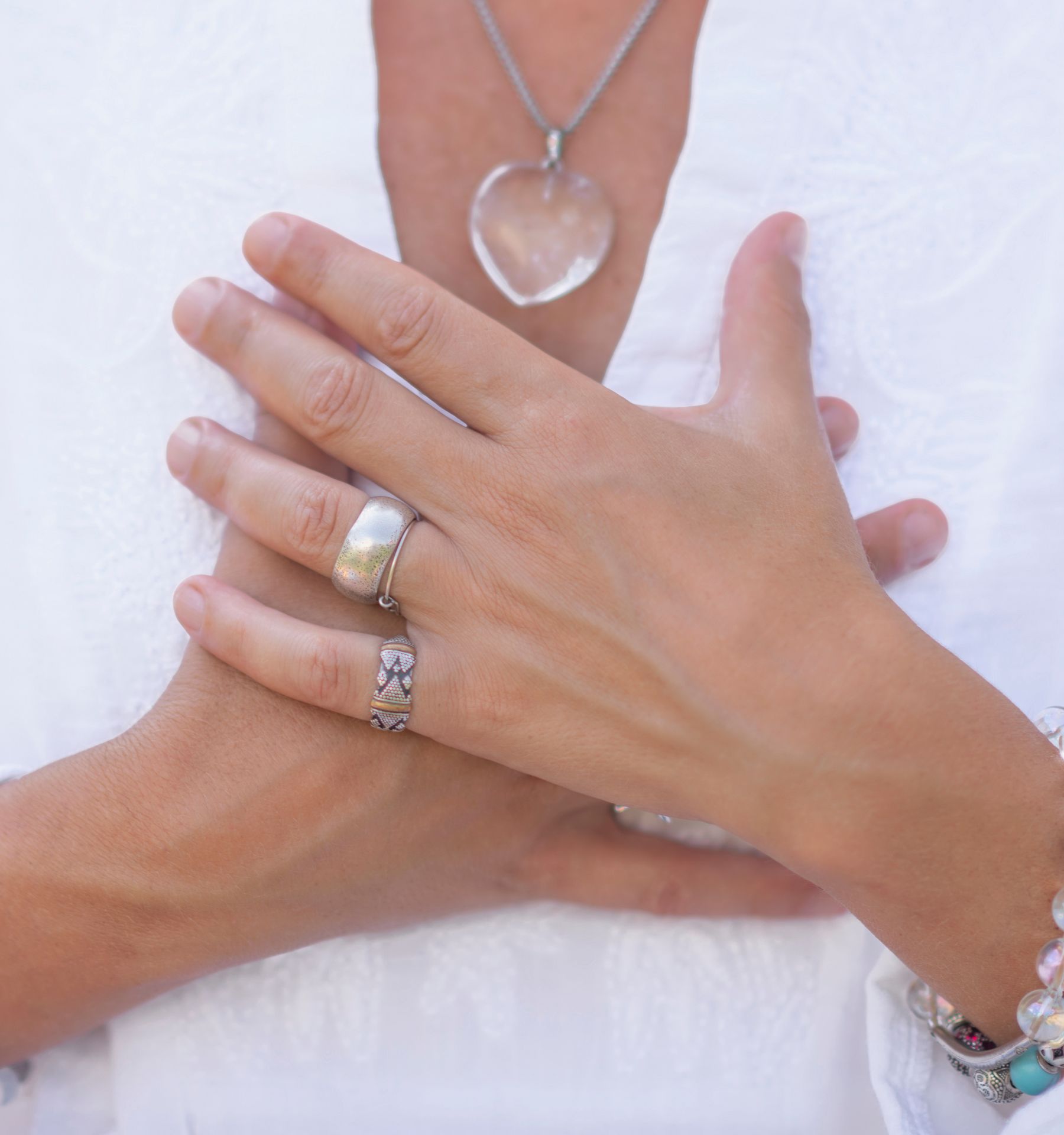 A lady with hands over heart