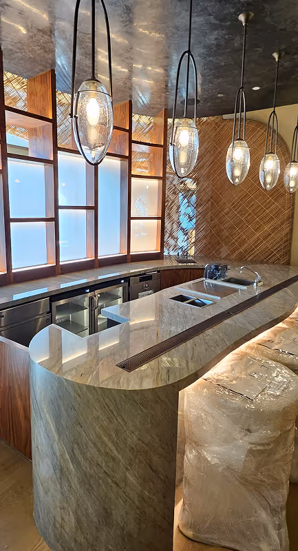 Polished marble bar counter in luxury Dubai interior after professional stone restoration service.