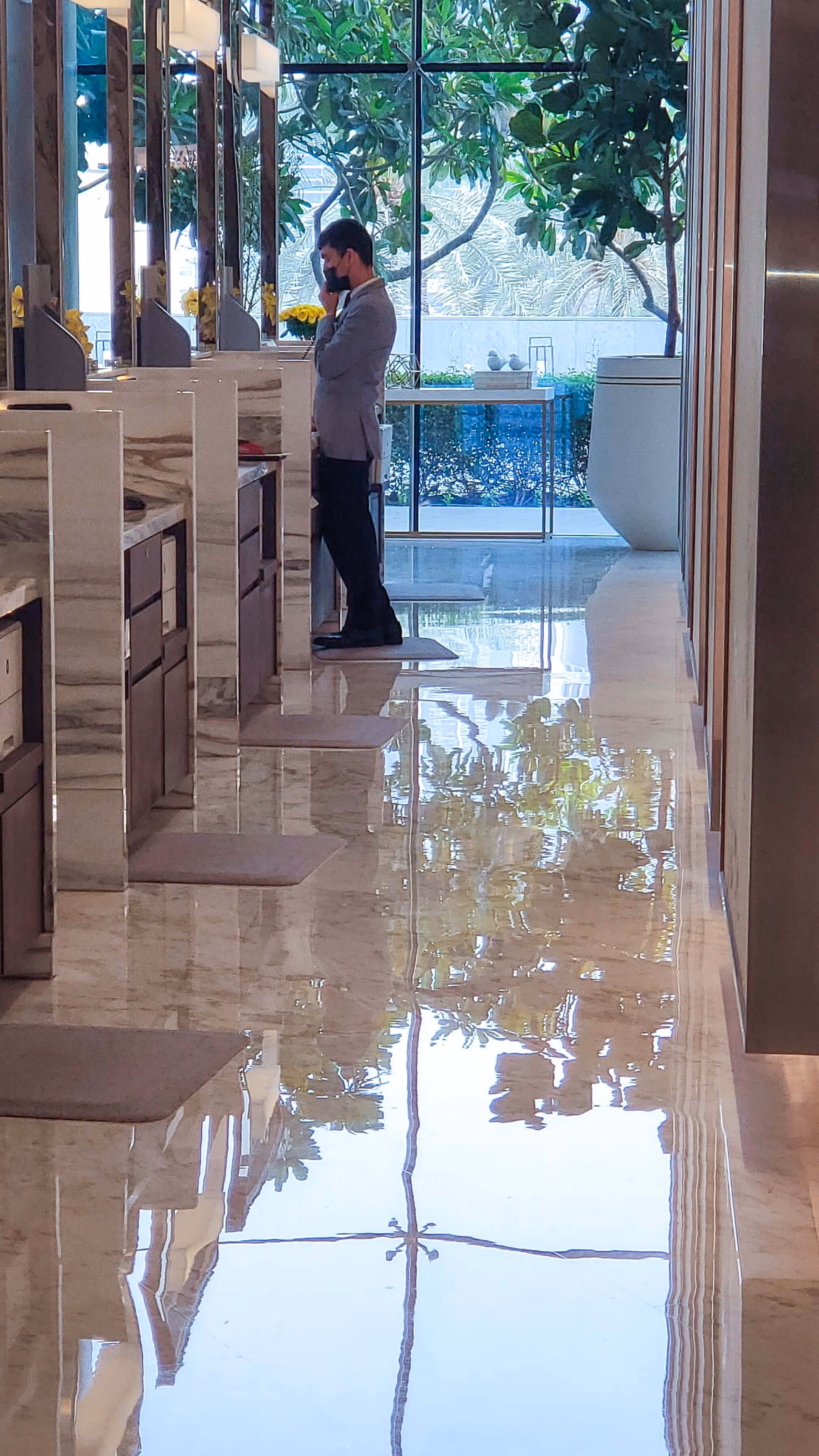 Polished marble floor in luxury Dubai lobby reflecting natural light after professional stone restoration.