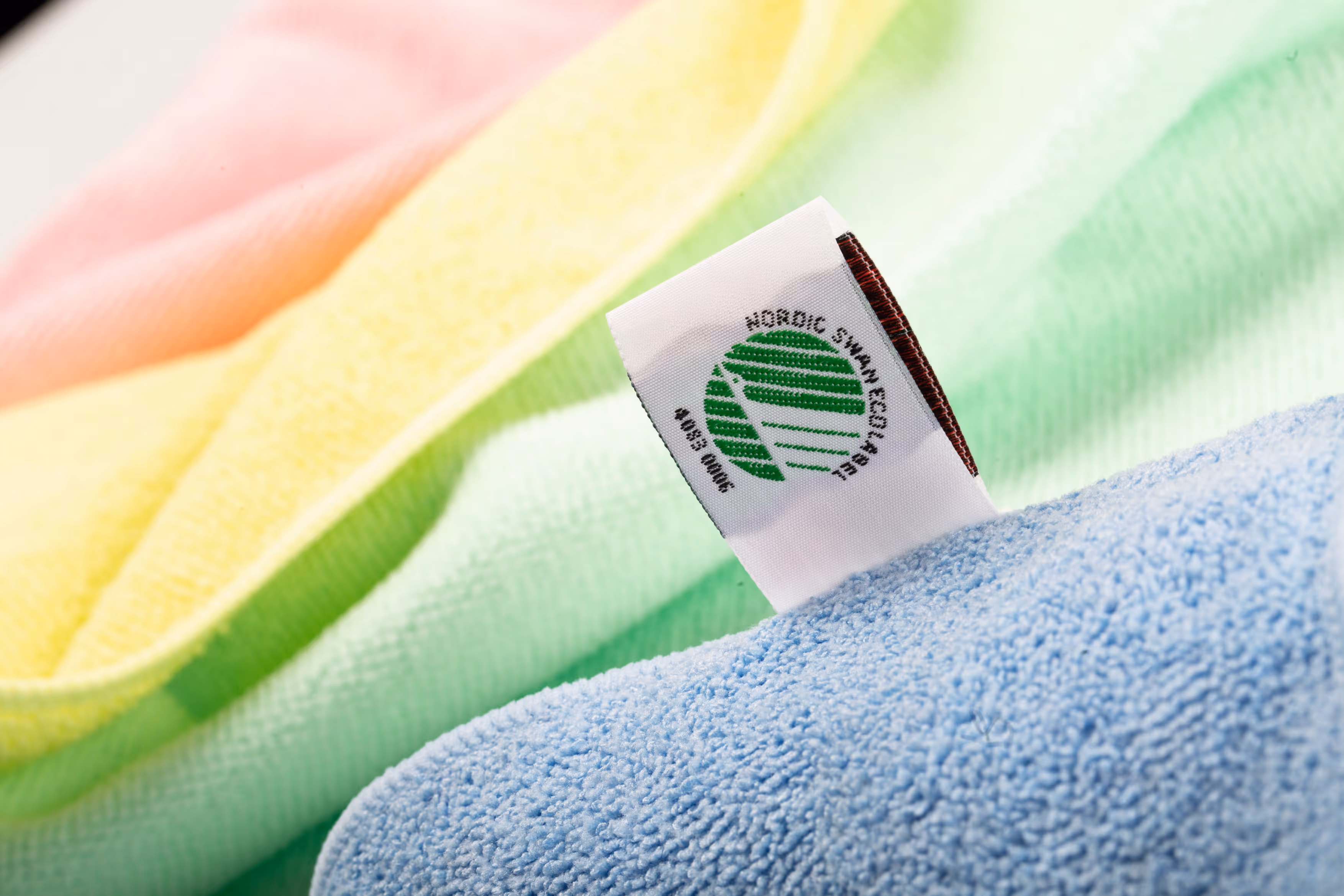 Eco-friendly microfiber cleaning cloths with Nordic Swan Ecolabel certification, symbolizing sustainable and high-quality cleaning products.