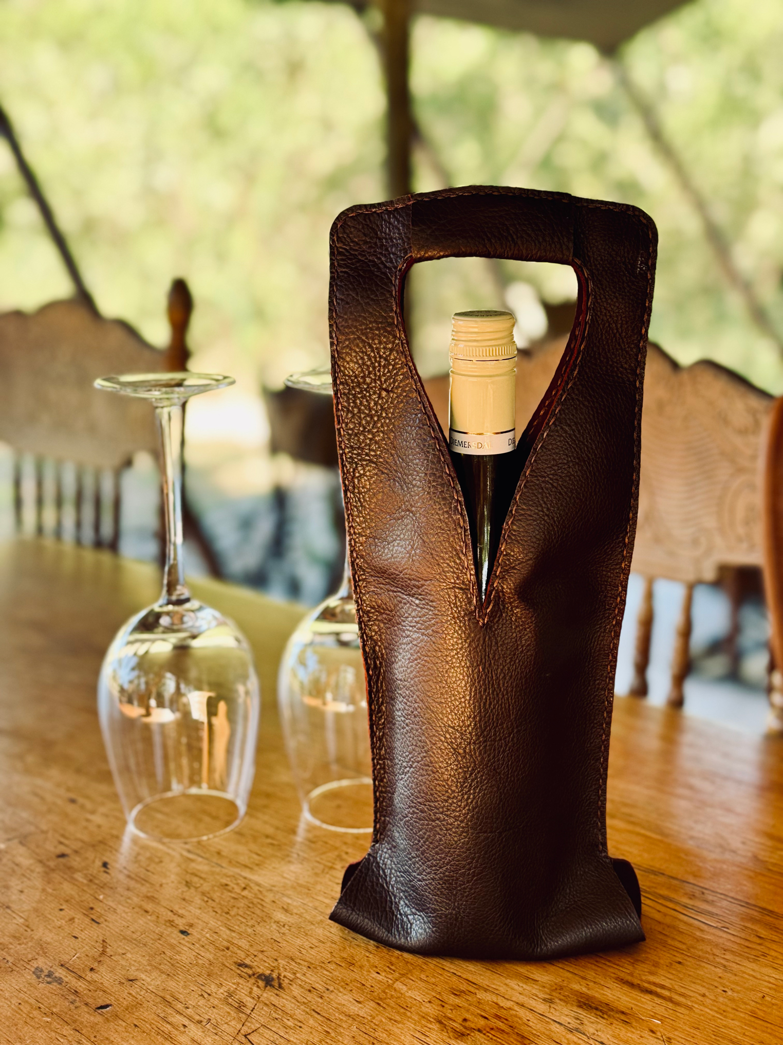 Handcrafted leather wine carrier for gifting and picnics