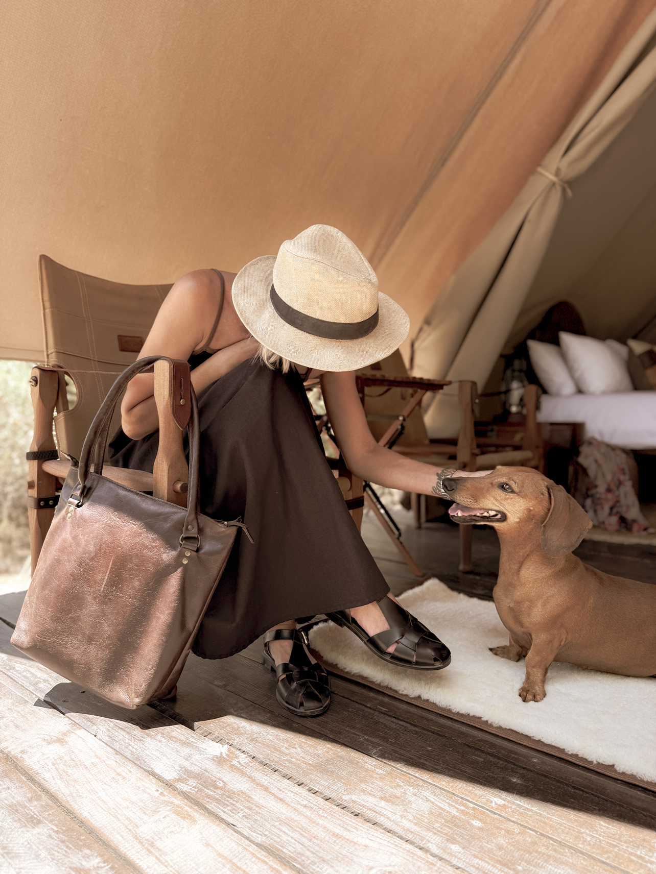 Roll up handmade leather dog travel bed linned with merino wool.