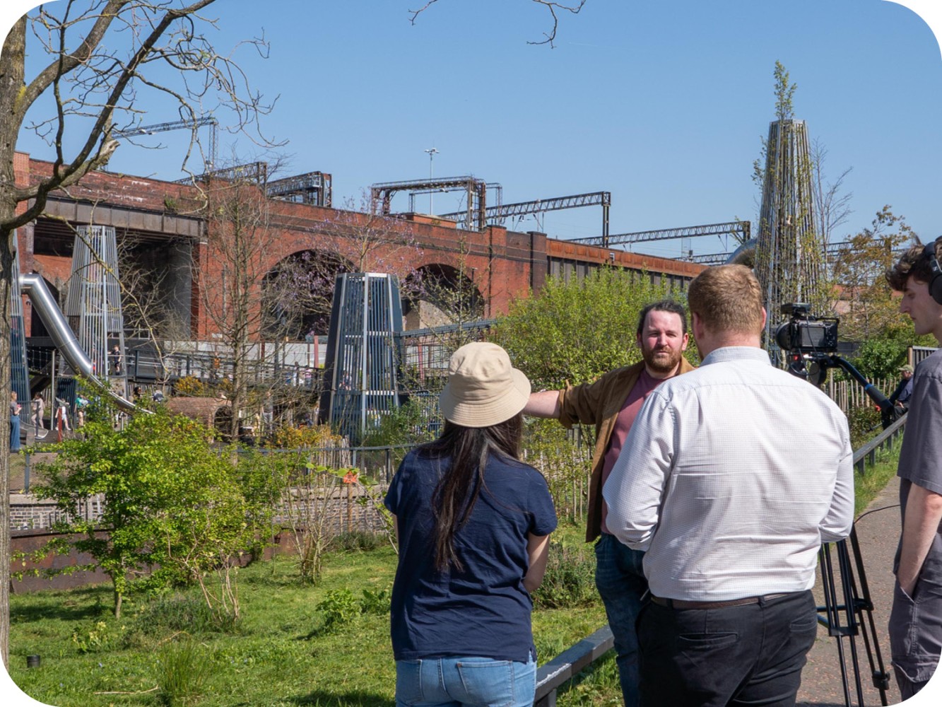 Matt, Product Manager at Massey & Harris, being interviewed at Mayfield Play Yard with film crew and production team