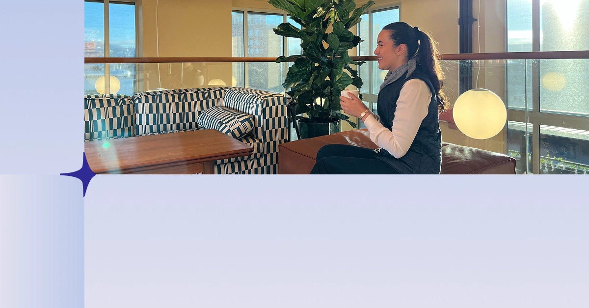 woman seating with a coffee cup