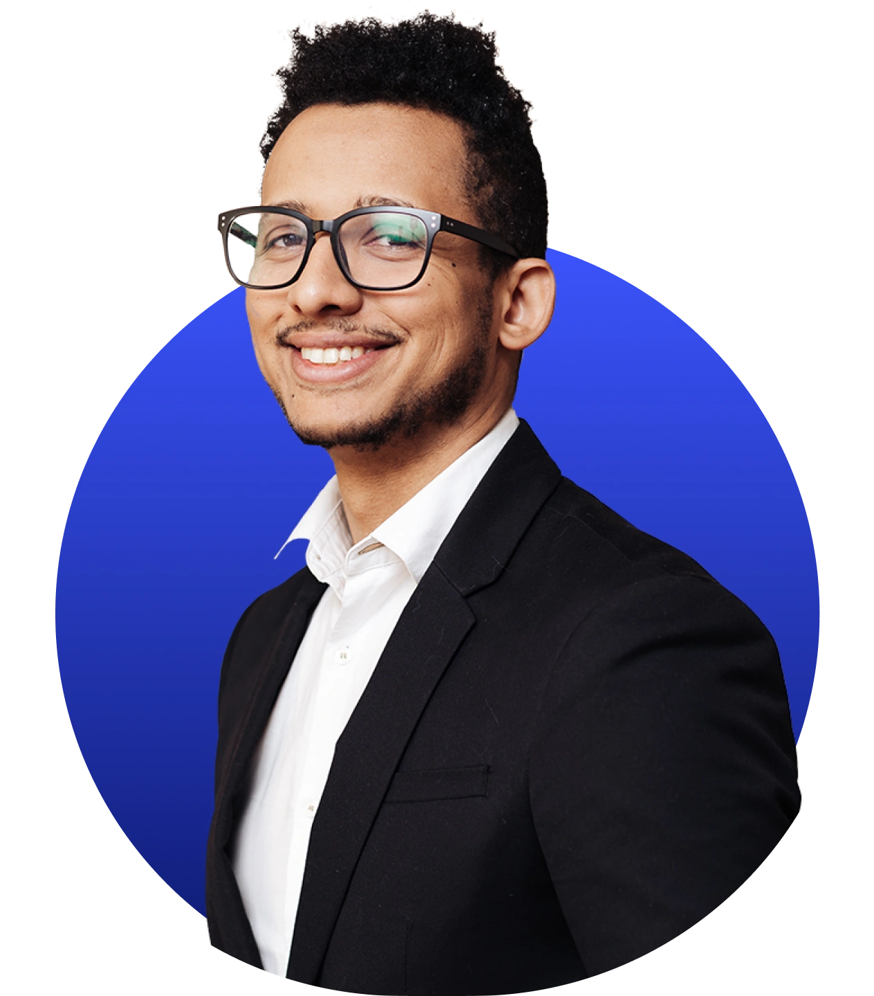 Smiling man with glasses in a black blazer and white shirt against a blue circular background.