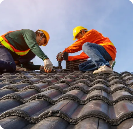 2 men working on the roof