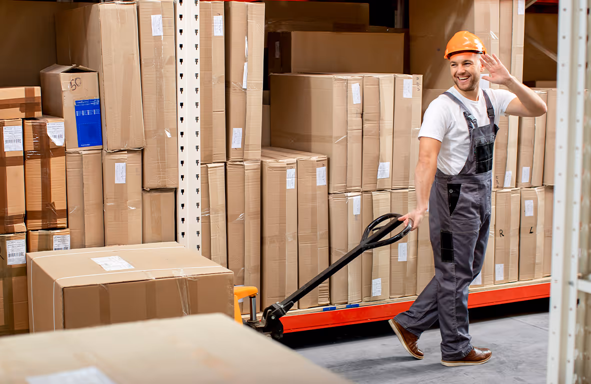 A fulfillment center team member receiving and slotting inventory in a warehouse.