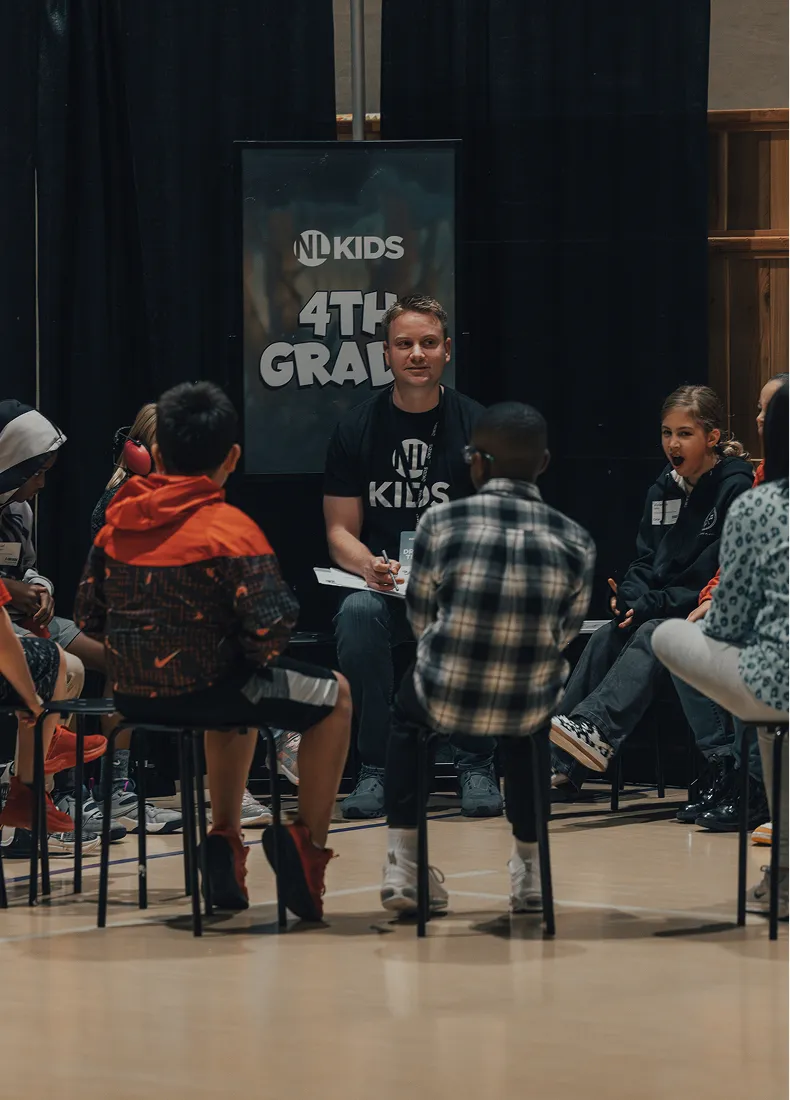 4th grade NL Kids event with students and leader in classroom setting
