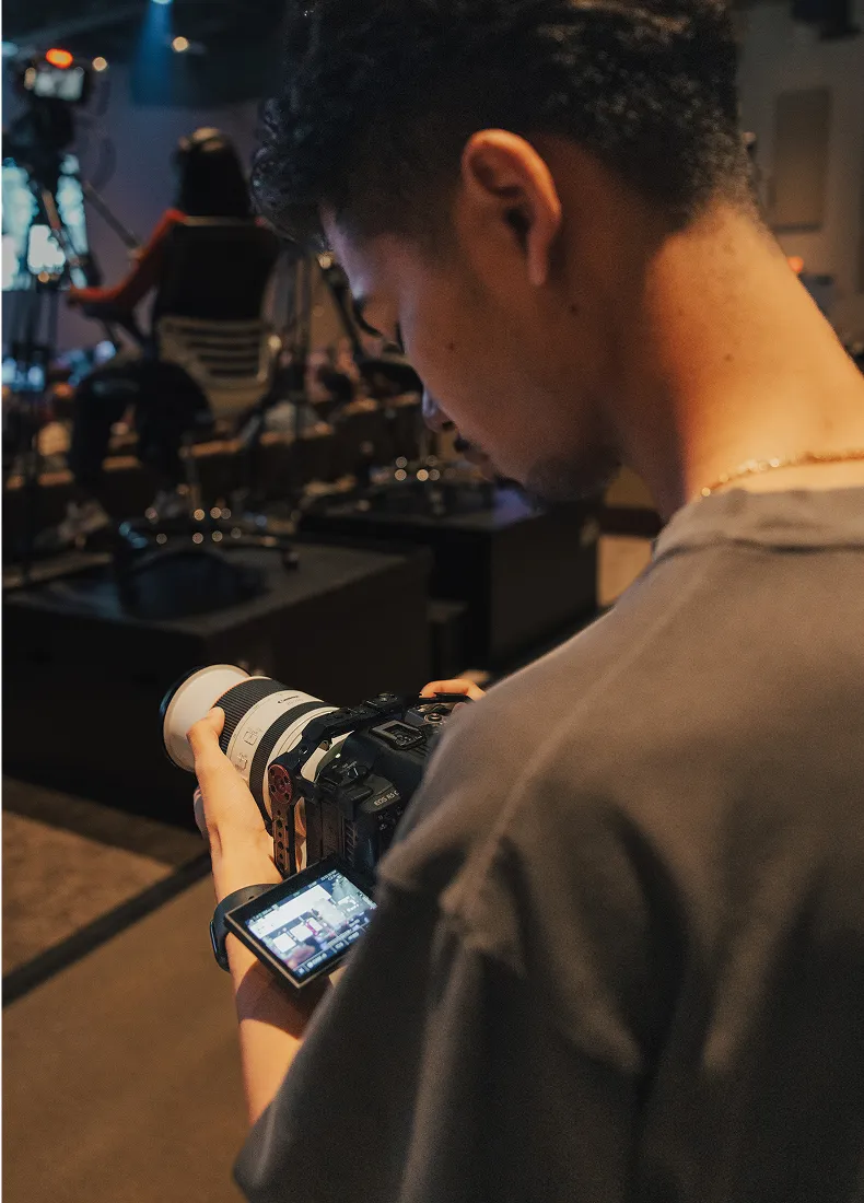 Photographer checking camera settings during a low-light event shoot