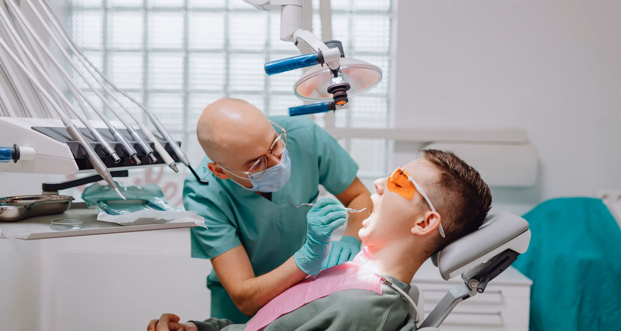 dental associate examining a patient