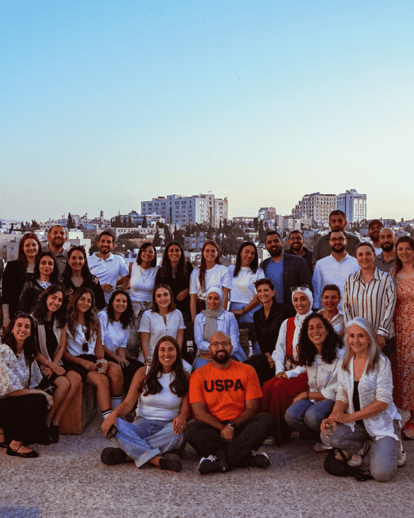 Group photo of Sira Community members from Jordan and the UAE connecting and growing together through shared values.