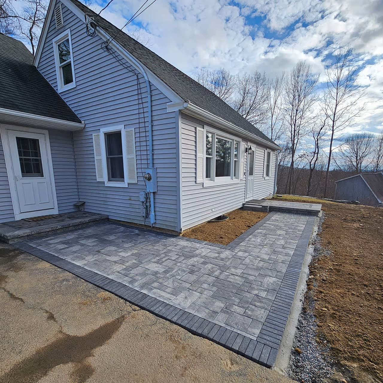 Stone patio with fire pit by Classic Outdoors Litchfield County CT