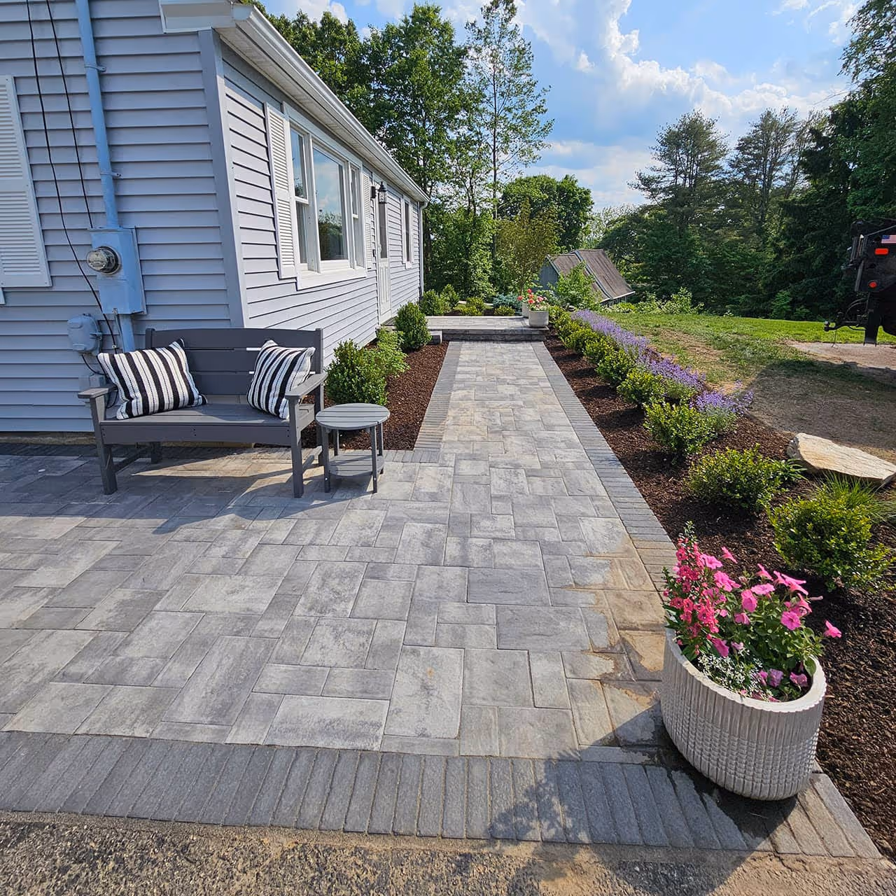 Stone-patio hardscape installation by Classic Outdoors, Washington CT