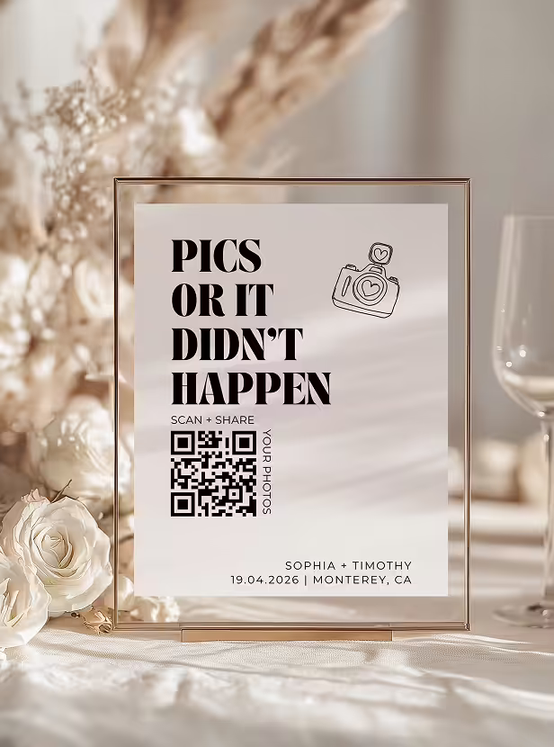 Table sign with text 'Pics or it didn't happen,' a camera icon, a QR code, and names Sophia and Timothy with date and location details.