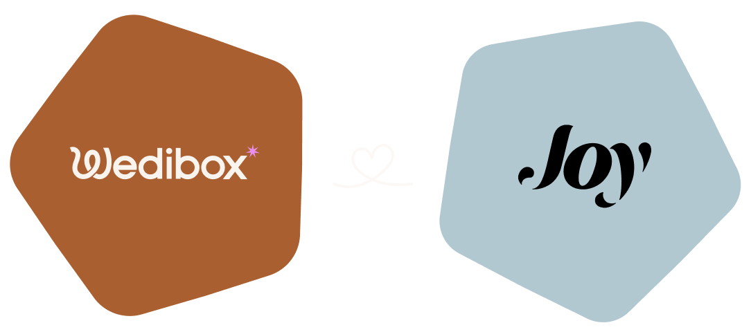 Wedibox logo on a brown pentagon shape connected by a white heart line to the Joy logo on a blue pentagon shape.