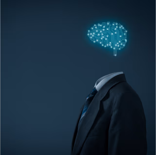 An image showing an invisible individual wearing a suit and tie but only his brain appears on screen in glowing blue connectors like a micrprocessor.
