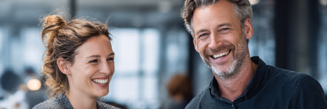 Couple smiling in a office