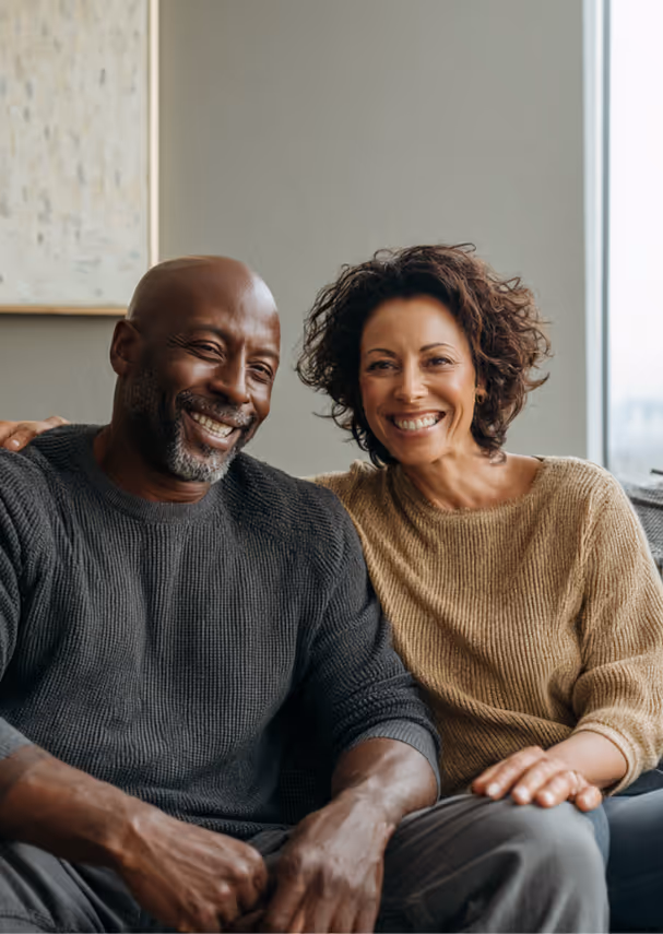 Couple Smiling in Living Room couch