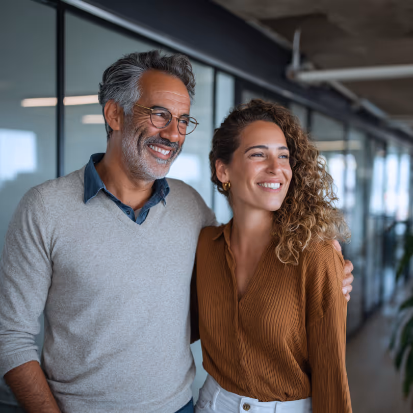 Couple in an office smilling
