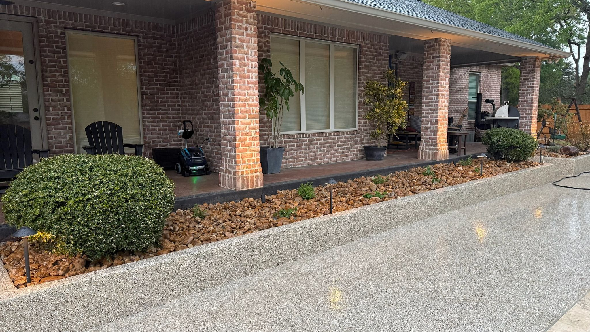 Front view of stone home with ivy-covered exterior and new shingle roof in Southlake TX