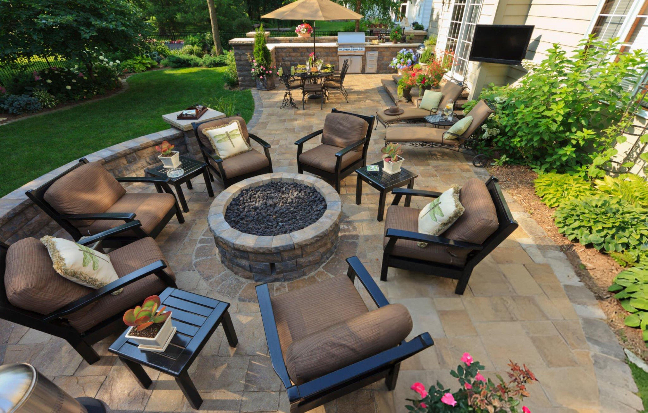 Front view of brick and stone home with landscaped yard and new shingle roof in Southlake TX