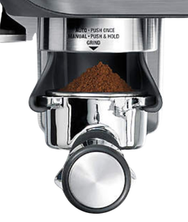 Step 1: Push portafilter to dispense grounds