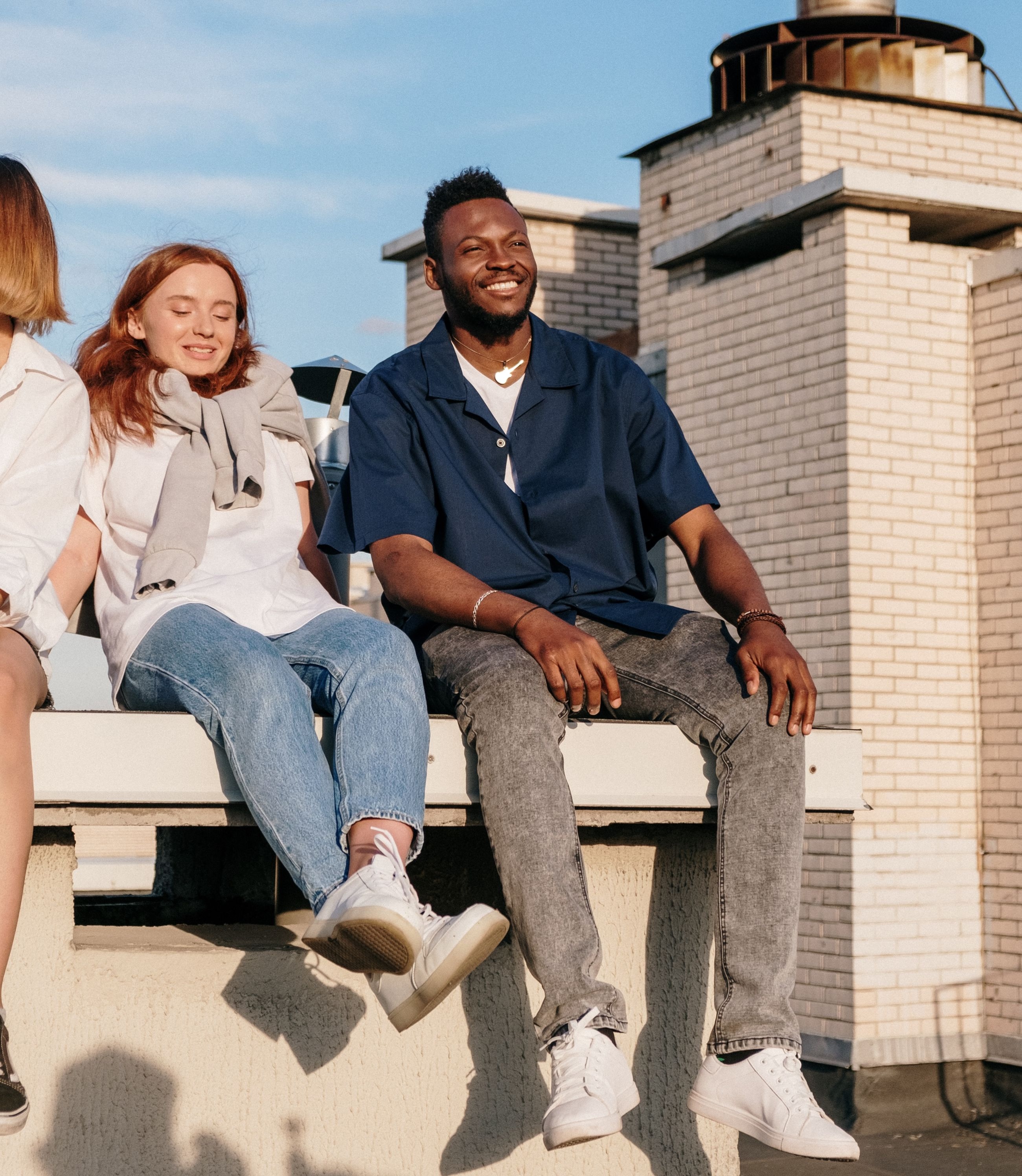 man and woman sitting outside stock image