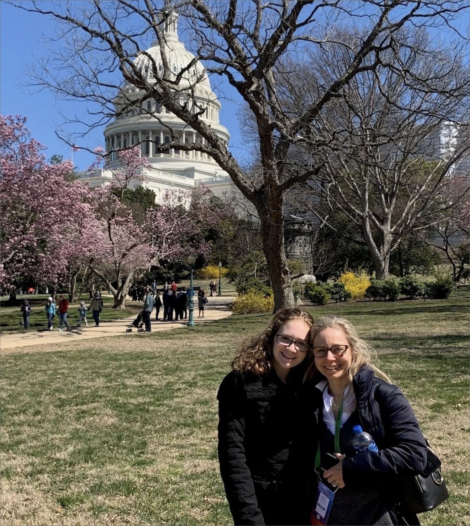 An FLI mother and daughter smiling in front of the U.S. Capitol