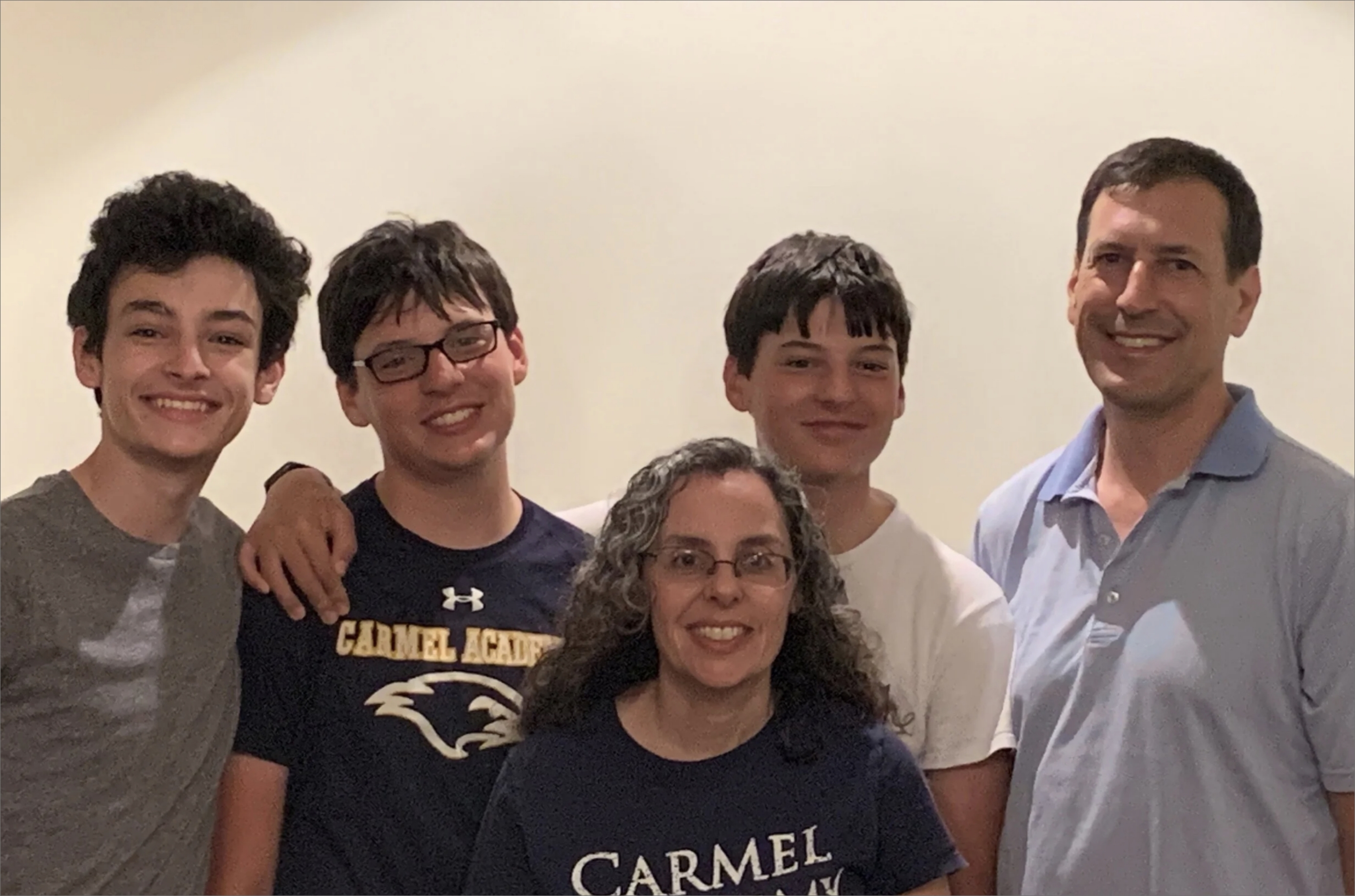 An FLI family of 5 smiling