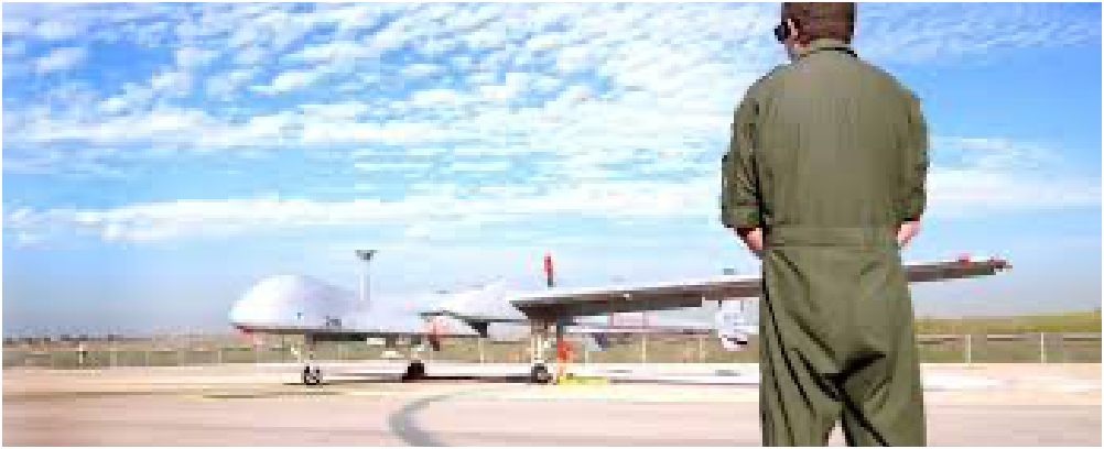 military officer standing in front of a military aircraft