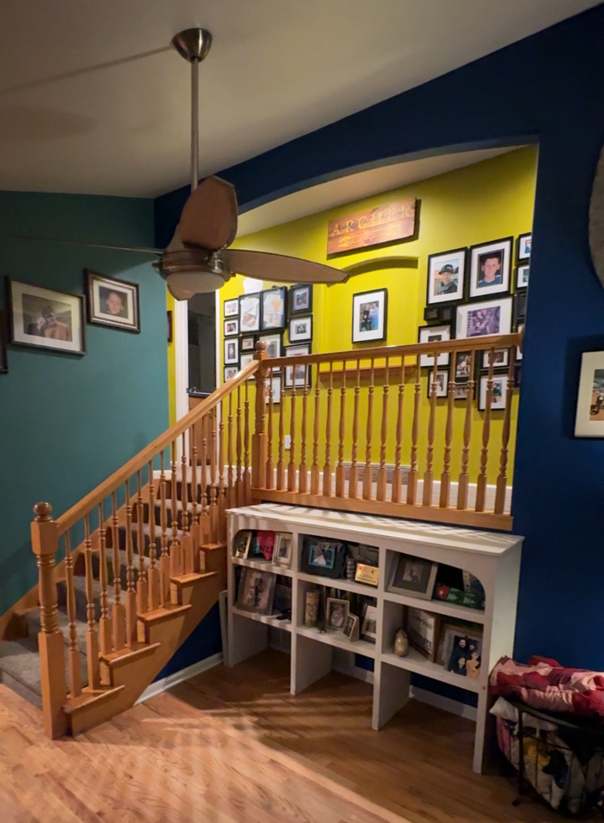 Handrail entry way to a living room 