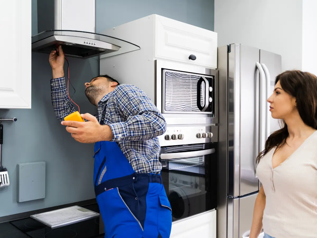 appliance technician repairing an oven fan in eastvale