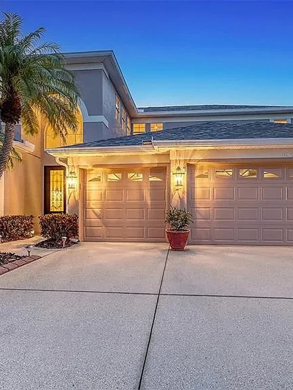 Sarasota home exterior renovation with fresh paint, updated lighting, and driveway upgrade