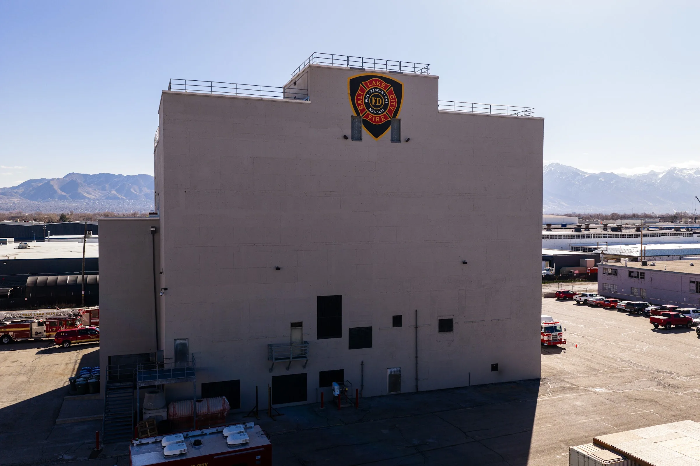 After: the fire station training tower with repaired, clean concrete walls.
