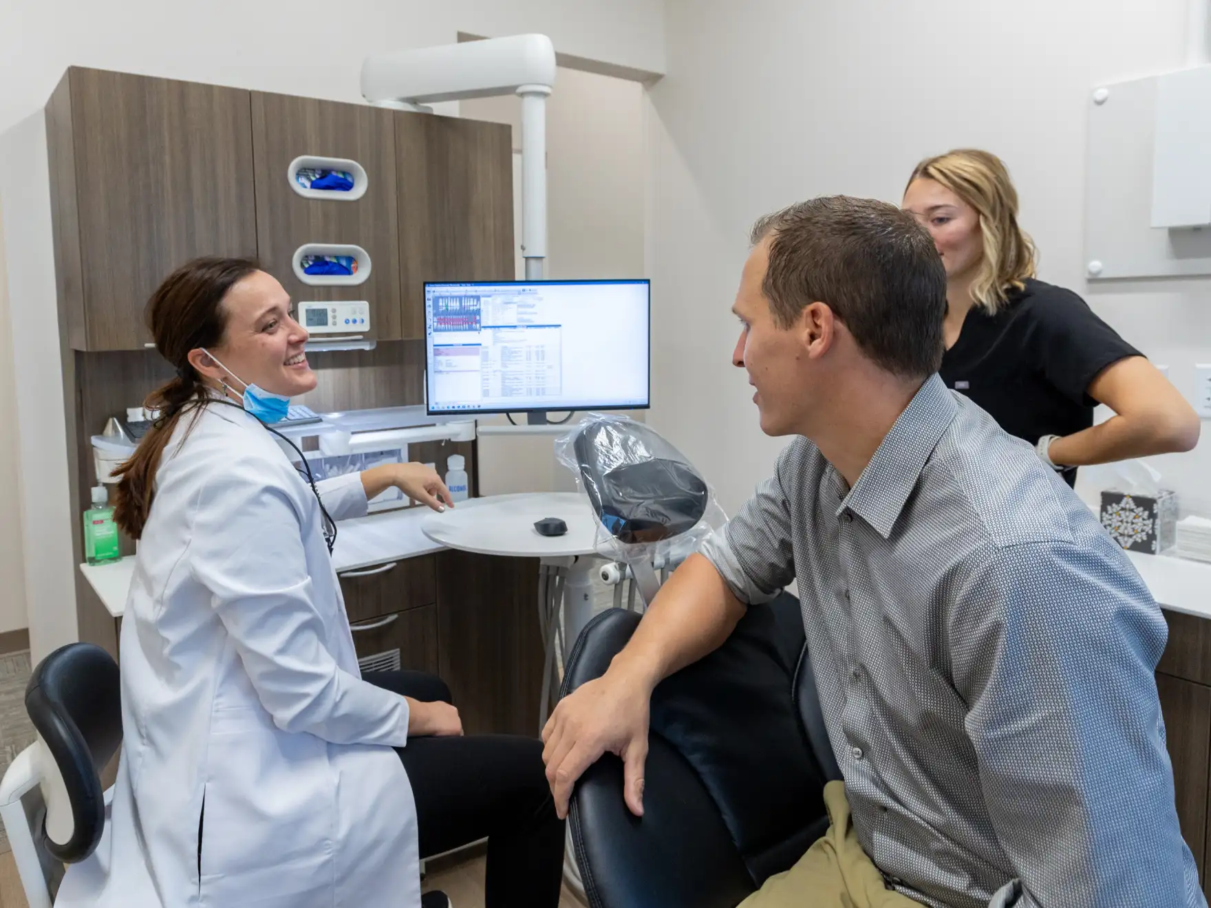 Dr. Wendy Peterson explaining treatment to patient