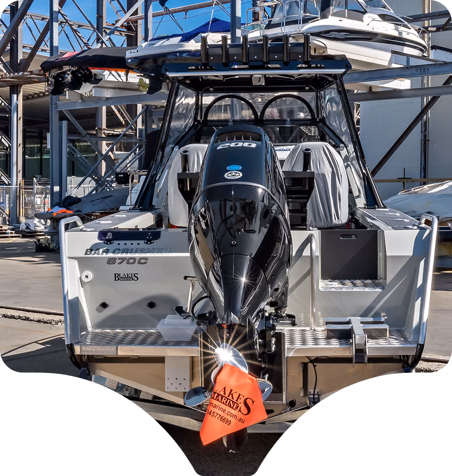 A sleek motorboat with a powerful engine is docked at a marina. The gleaming metal and vibrant red safety flag convey readiness and adventure.
