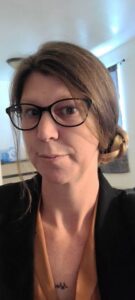 A selfie of a woman wearing glasses