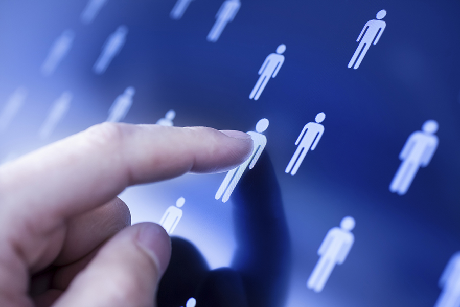 hand pointing at a touch screen with people icons