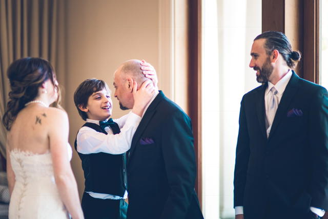 young boy and family at wedding