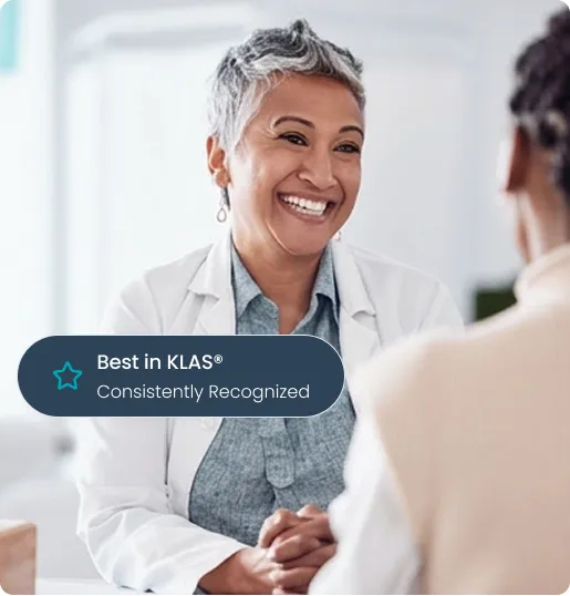 Smiling female doctor talking with a patient in a bright medical office.