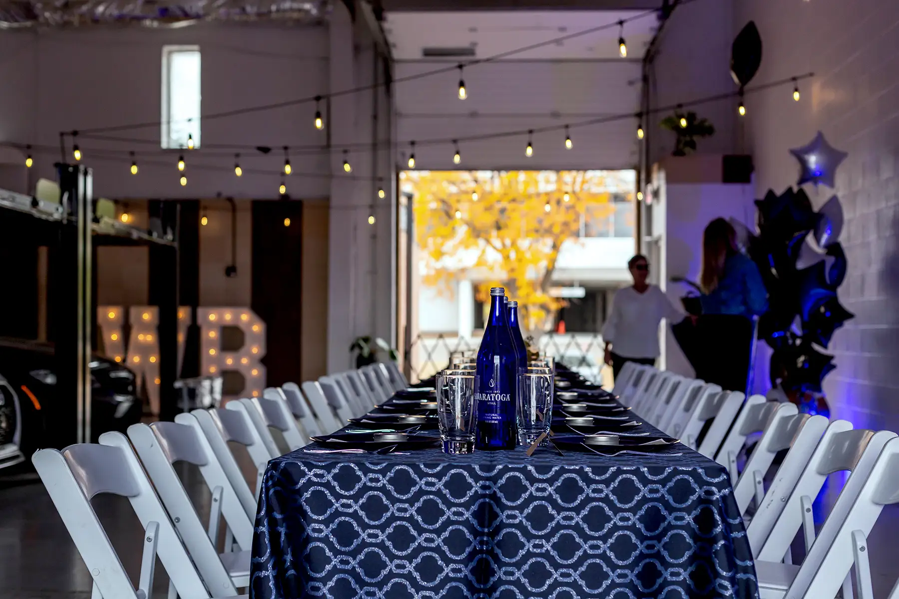 A long haul dining set up for a surprise party at Millrace
