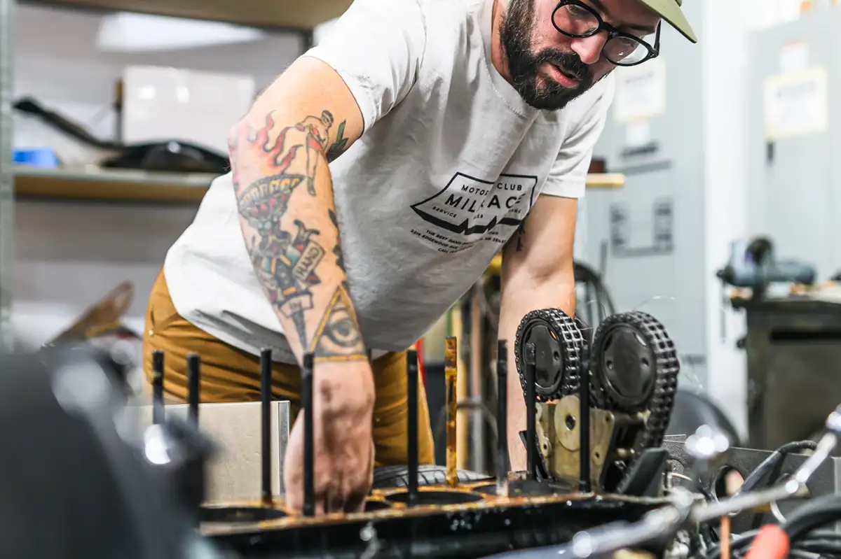 A mechanic torquing a bolt on a transmission