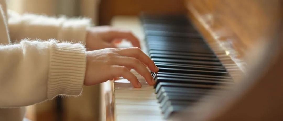 child-hands-piano-closeup.jpg