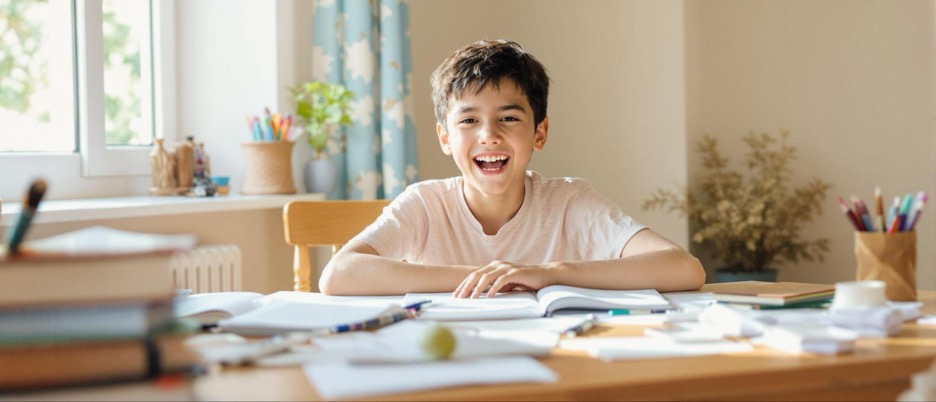 smiling-homeschooled-boy-at-table.jpg