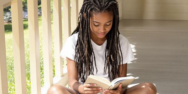 teen-reading-on-a-front-porch.jpg