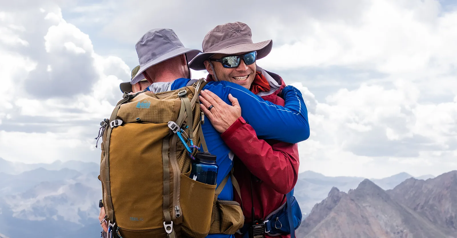 Two retreat members embrace at the summit