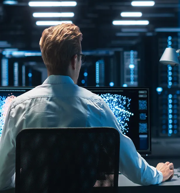 A man running complex simulations on a workstation