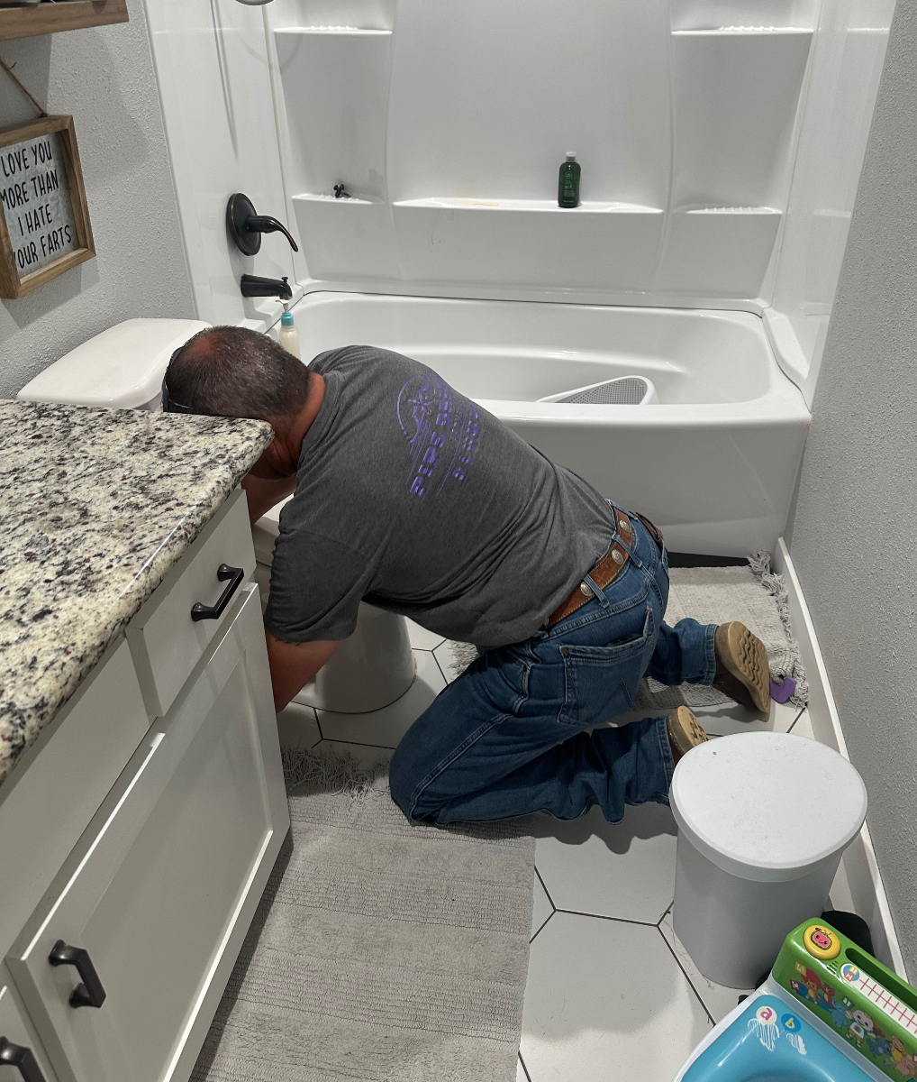 Plumber performs drain maintenance in Allen, TX.