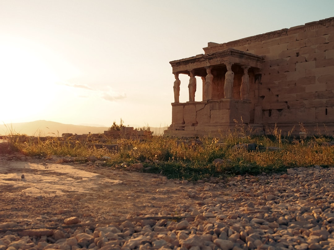 ancient ruins under a warm sunset