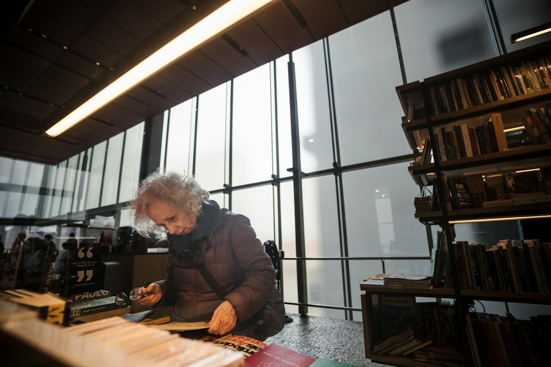 researcher examining historical records and audio recordings researcher examining historical records and audio recordings